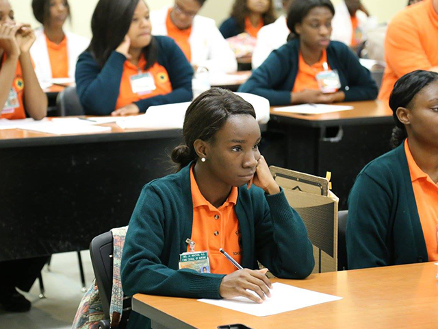 Nursing student paying attention in class